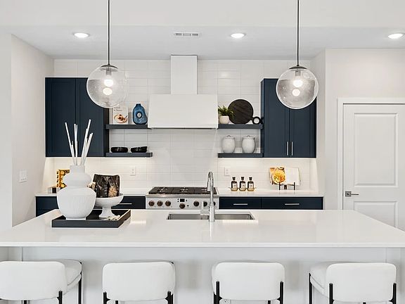Kitchen with quartz island and countertops