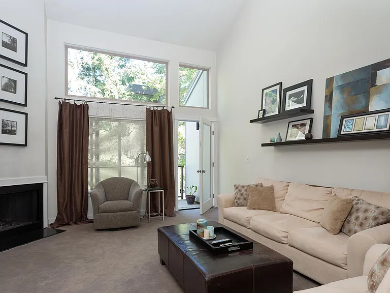 Vaulted ceilings that flood the space with beautiful natural light, cozy up by the fireplace or step out onto the deck.