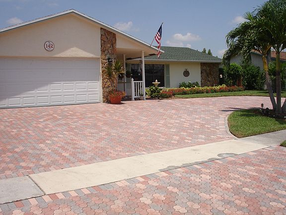 PAVER DRIVEWAY LEADS TO PAVERS ON SIDE OF HOUSE FOR PARKINGBOAT,TRUCKORTRAILER