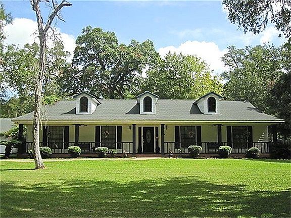 The 2.4+ Acres of land have lots of mature trees that help shade the property and give it a private and secluded look.