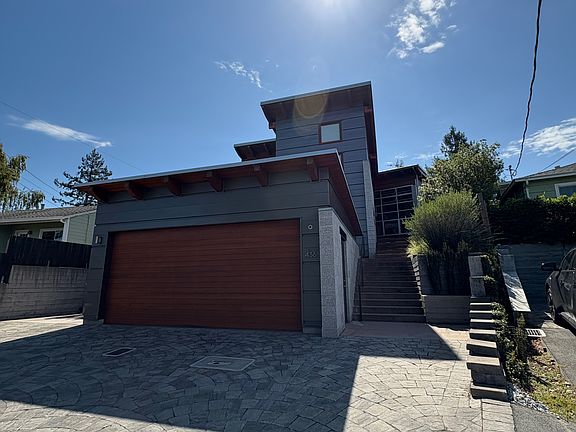 Front of house, showing 2-car detatched garage