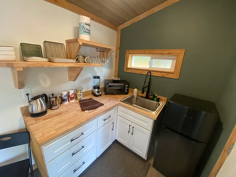 Kitchen has 1 induction burner hot pad, Toaster Oven, Hot water kettle