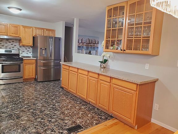 Lots of storage in oak cabinets