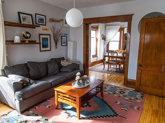 The living room is spacious and has great natural light