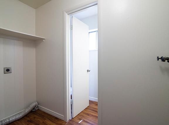Laundry area leading to 1/2 bath