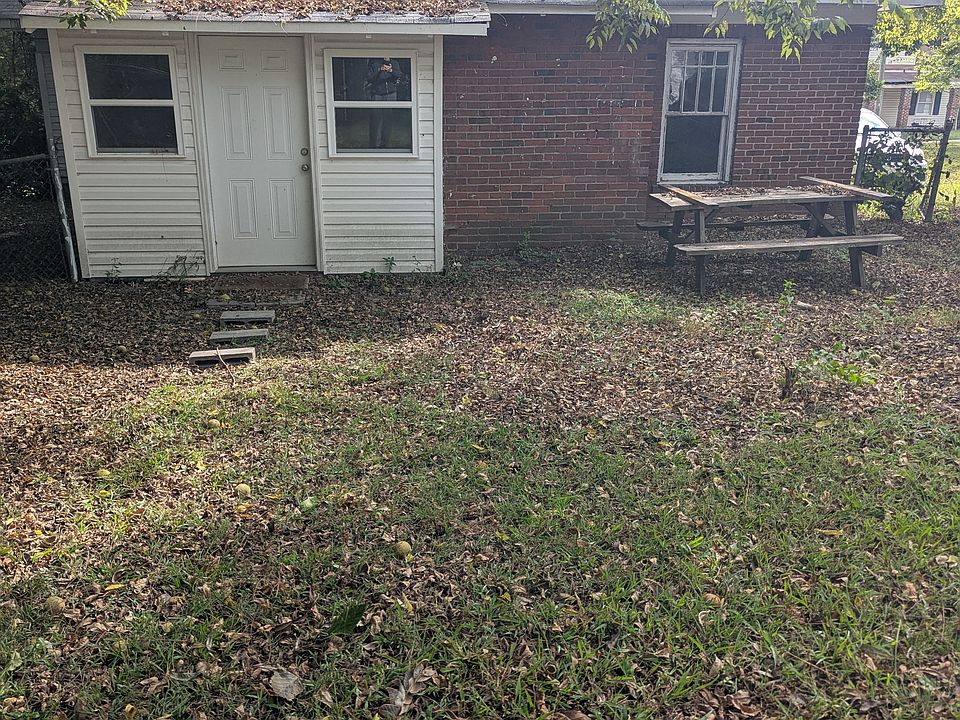 Back entrance with utility room and washer and dryer