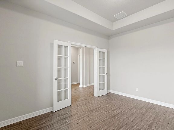 An additional view of the study with French doors.