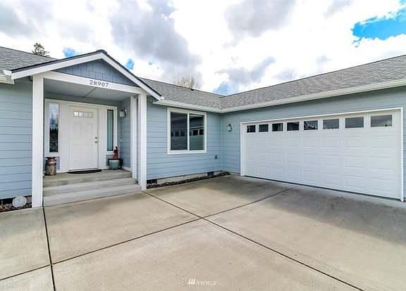 Large two car garage with two remotes. There's a door in the garage for direct access into the house.
