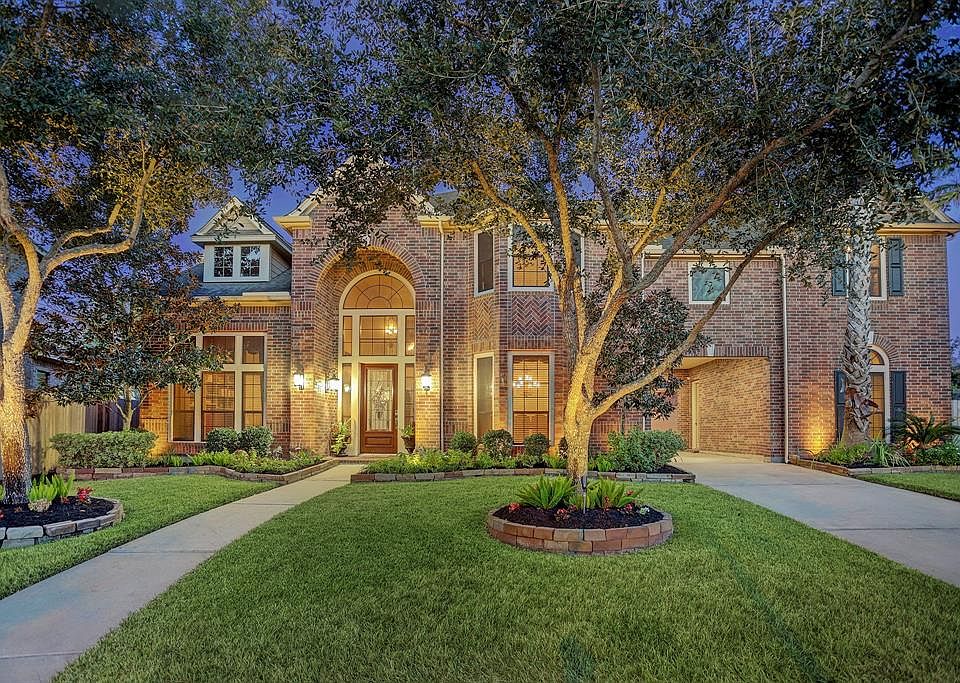 One in a million! Brimming with luxurious finishes inside and resort-style living outside, this home offers a very unique floorplan with two primary suites and multiple bonus rooms including two private studies, a sunroom, and a home gym. Enjoy the g