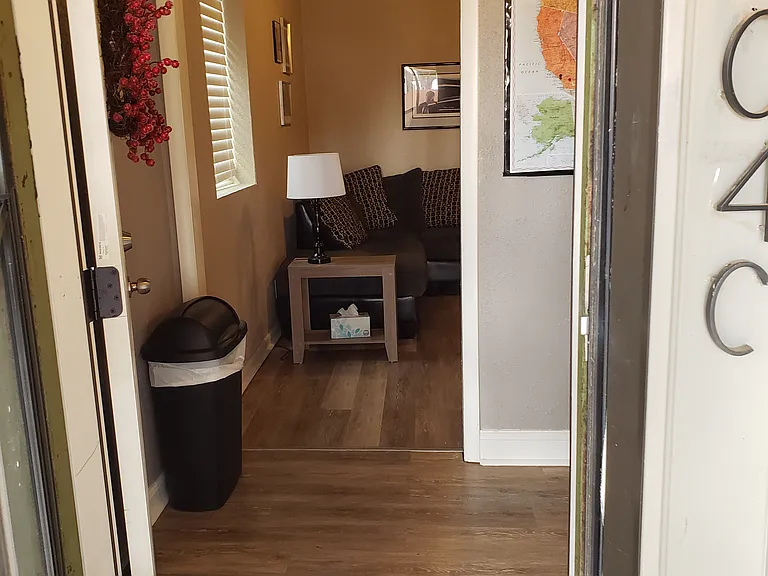 Kitchenette to the right and living room straight ahead.