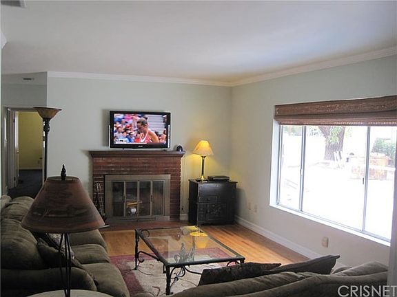 BRICK FIREPLACE IN LIVING ROOM