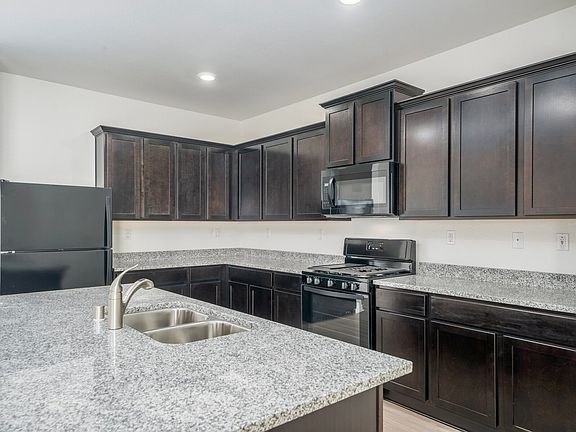 Stunning kitchen with a wall of cabinets