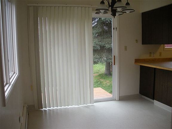 Dining room leads to back deck and large private fenced yard