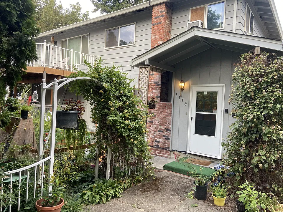 Front door with garden area just off the porch