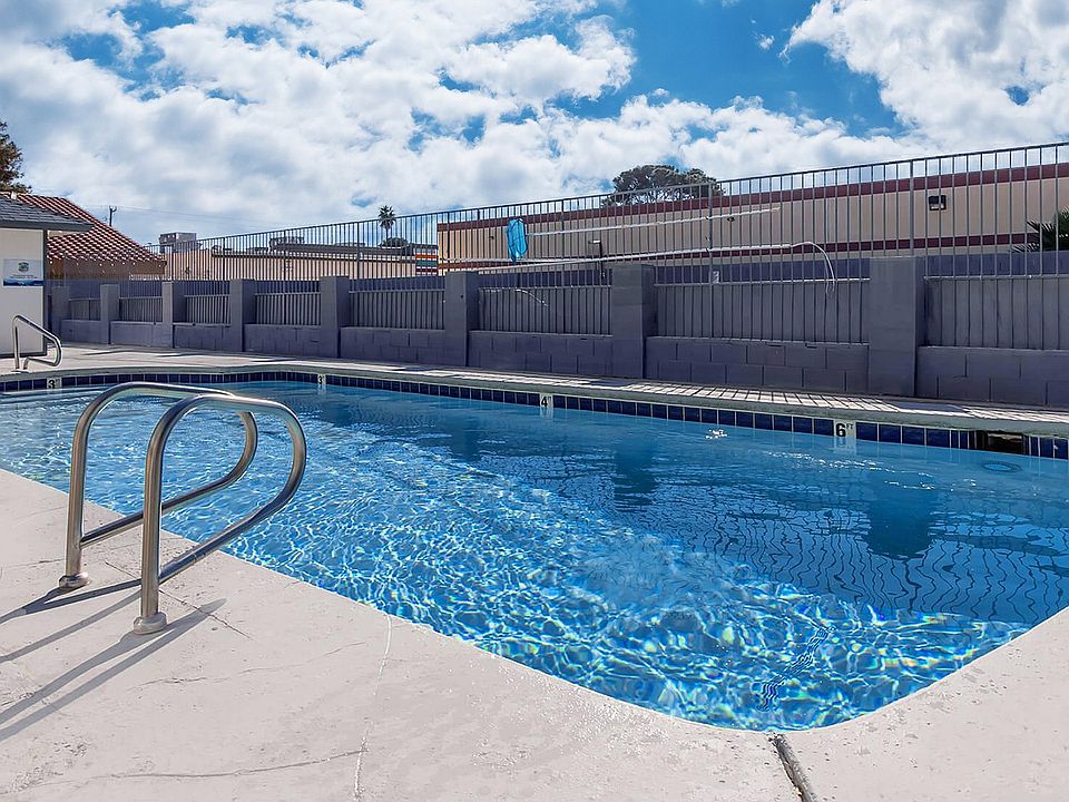 Dive into relaxation in this sun-drenched pool area, perfect for leisurely days.
