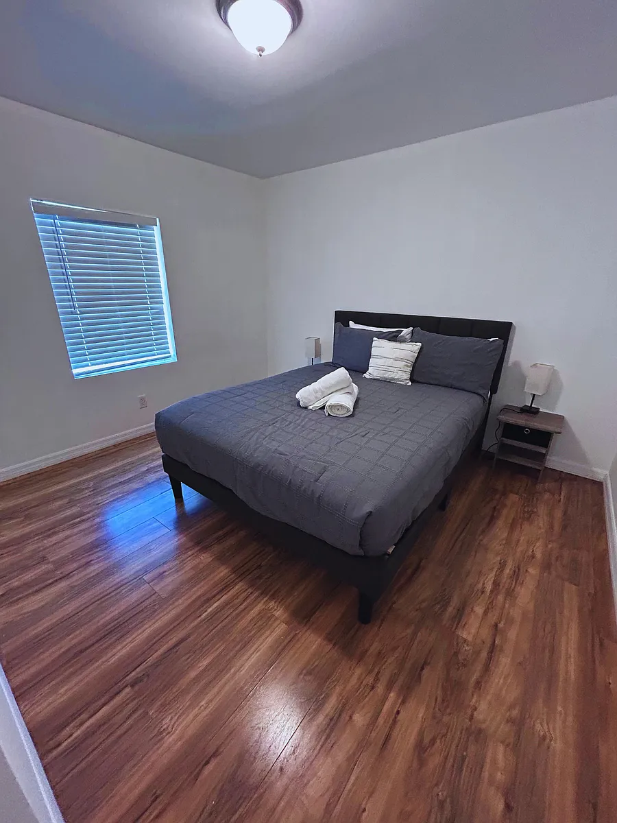 Spacious room with a beautiful window, blinds, and great natural light. - 4821 Old Harden Blvd