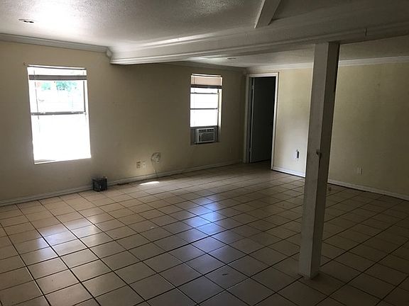 living area with double walk in closet