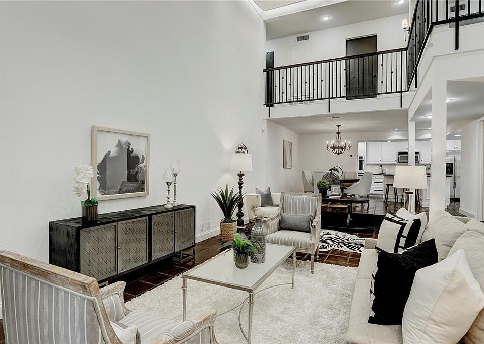 Once you walk into the door, you are pleasantly surprised by the stunning living area with the soaring ceiling, open floor plan and light blanketing the home through the perfectly placed skylights.