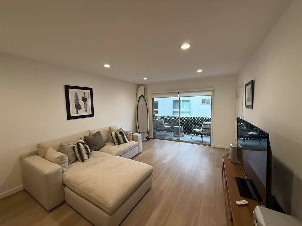 MAIN ROOM - LEADING TO SLIDING GLASS DOORS AND PRIVATE PATIO