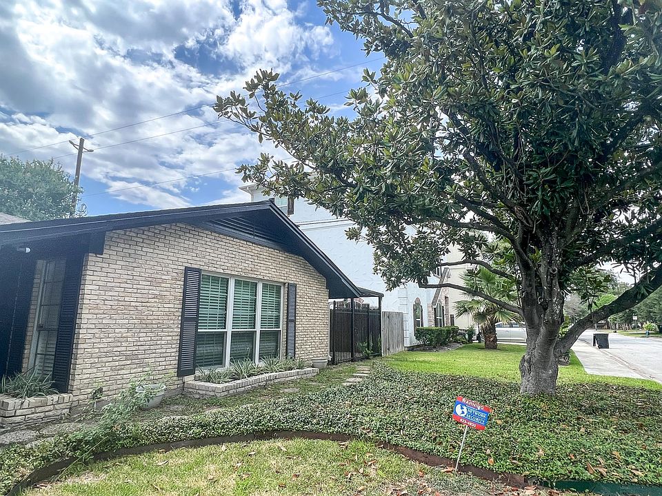 A beautiful magnolia tree greets you as you walk up and makes a great view out of the living room.