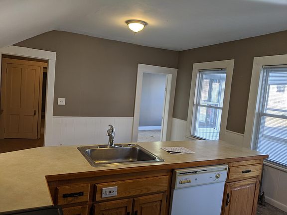 Kitchen looking at BR1 & Hallway to BR2 & Living room