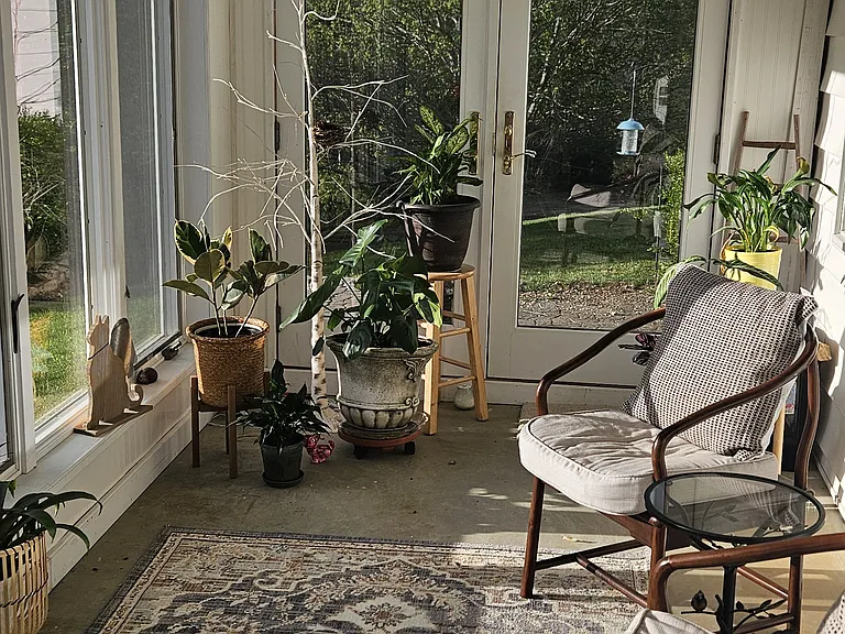 Sunroom with view of the river and access to firepit