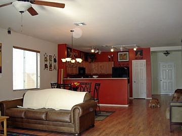 Very spacious floor plan with wood and tile floors.