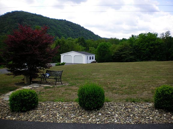 2 car garage with 2 +/- acres of land...just needs your dream home!!