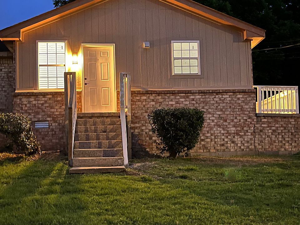 Outdoor night view of the front of the home. This duplex has its own side as the other side faces a different street.