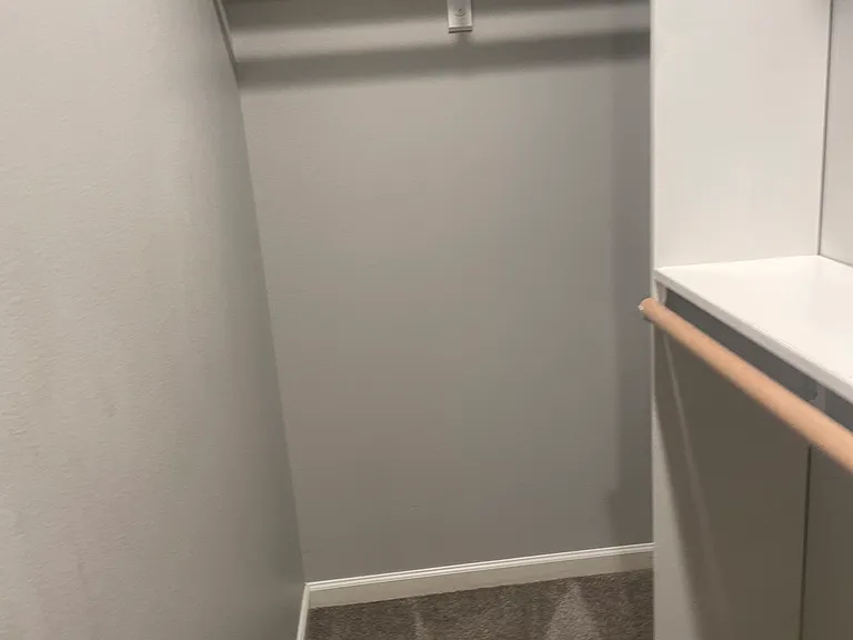 Small walk in closet for bedroom 3