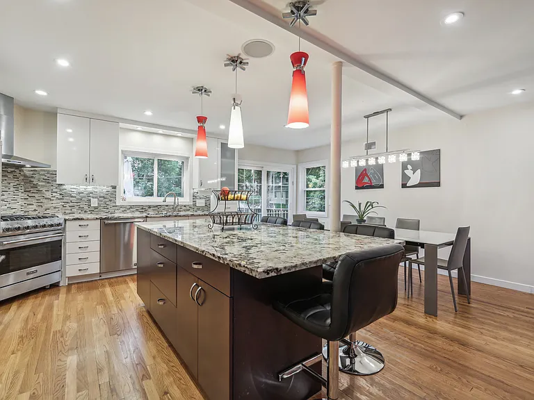 Modern Eat In Kitchen With High End Appliances