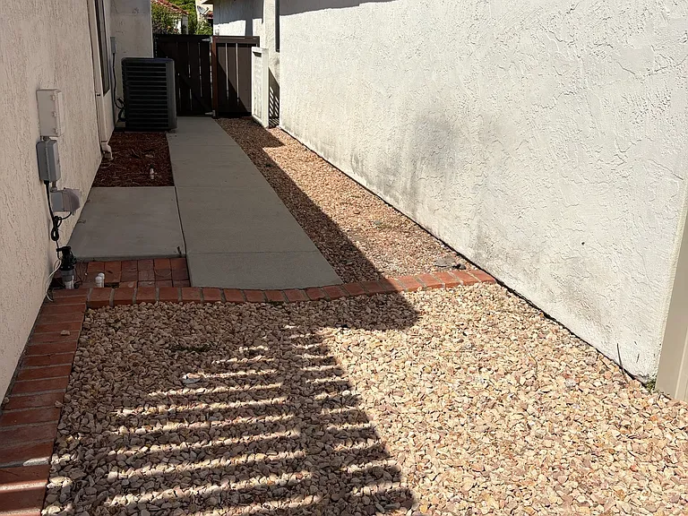 Side walkway with gate.