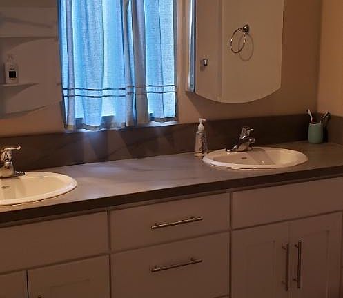 Dual Sink Bathroom with two medicine cabinet mirrors