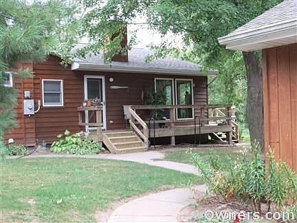 Side view standing in front of garage