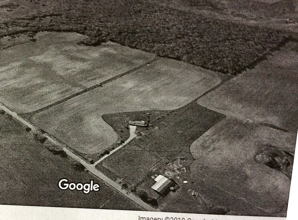 Aerial barn, woods, fields