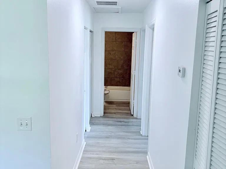 Near bedrooms 1,2, main restroom and washer and dryer area