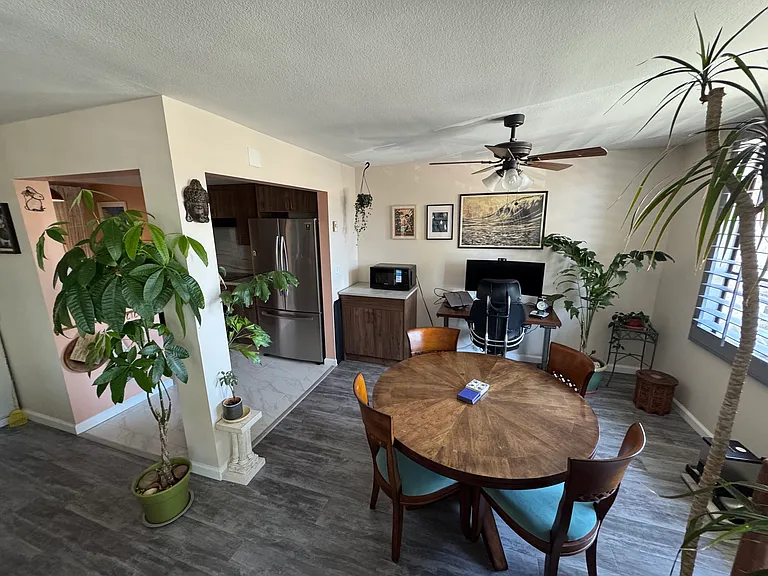 Dining area adjacent to kitchen. External window visible on right side of picture.