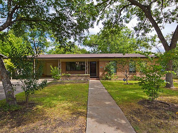 A charming front porch is wa