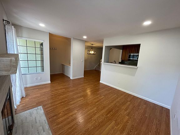 Open living room with fireplace.