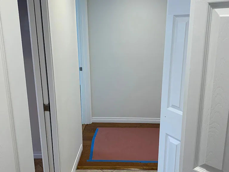 from laundry hall toward bedroom hallway