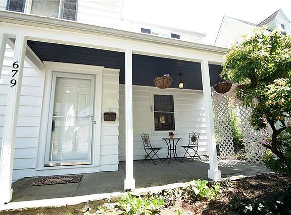 Covered Front Porch invites you to sit and relax and watch the world go by.