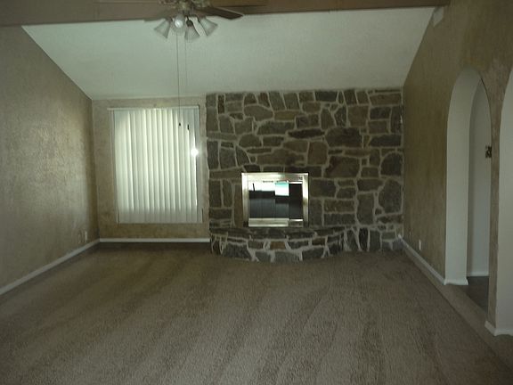 Natural rock fireplace in huge family room.