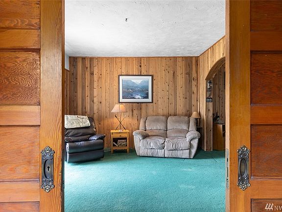 Vintage sliding doors between the entry and the living room.