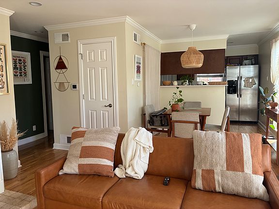 Living room and dining room. Coat closet in middle hallway.