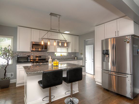 Gorgeous 42" Maple Shaker Cabinetry with Stainless Handle Pulls