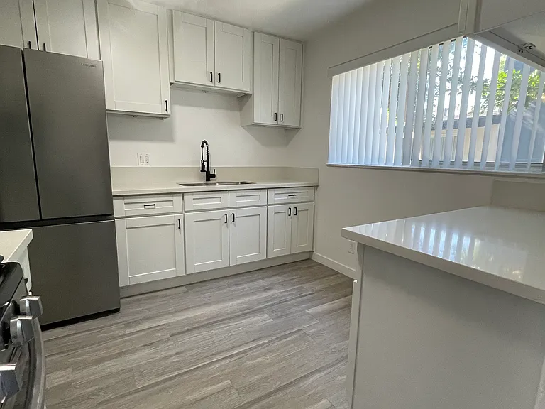 Kitchen with soft close cabinets and a smart refrigerator