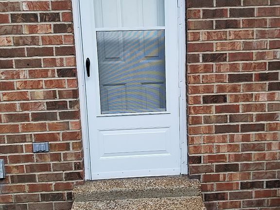 Back door near to private parking for 2 cars and grilling.