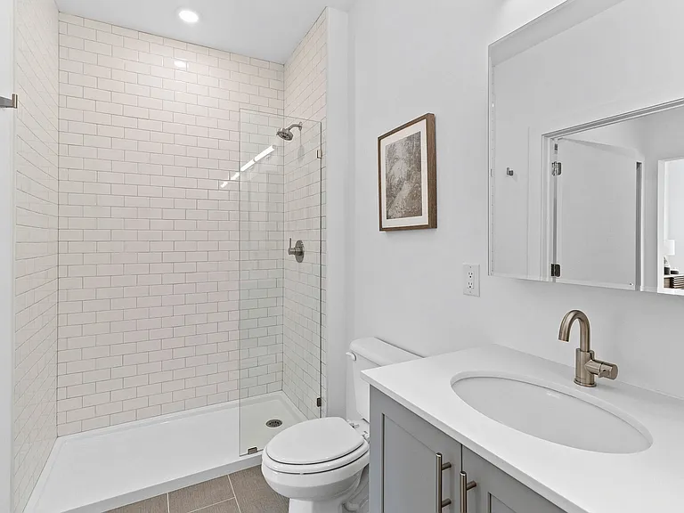 Experience luxury in every detail with this elegantly designed modern bathroom.