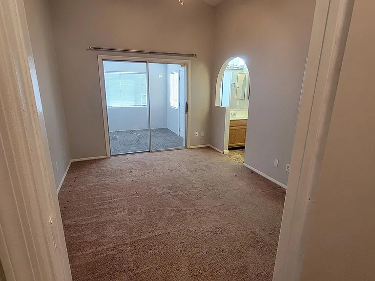 View of Master bedroom from walk in closet.