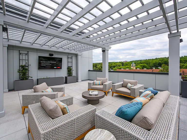 Rooftop deck with pergola, TV, and panoramic views